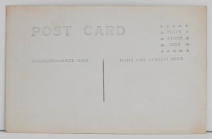 Two cute babies in a wicker chair - Postcards