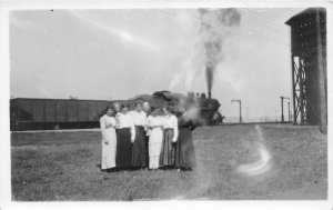 G33/ Clarke Iowa RPPC Postcard c1910 Train Railroad Water Tower Women