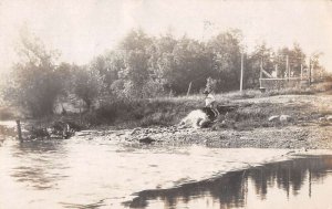 Forest City Iowa Boy by River  Scenic View Real Photo Postcard AA50737