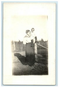 c1910's Mother Carrying Little Boy At Fence RPPC Photo Unposted Antique Postcard 