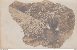 RP: HAMILTON , Ohio , 1907 ; Portrait of man sitting on a stump