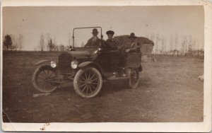 People in Tin Lizzie Ford Motel T Old Automobile 'Engineer' ?? RPPC Postcard H36