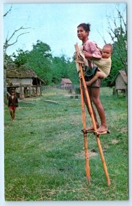 KONTUM, SOUTH VIETNAM ~ Montagnard BOYS on BAMBOO STILTS 1950s-60s  Postcard