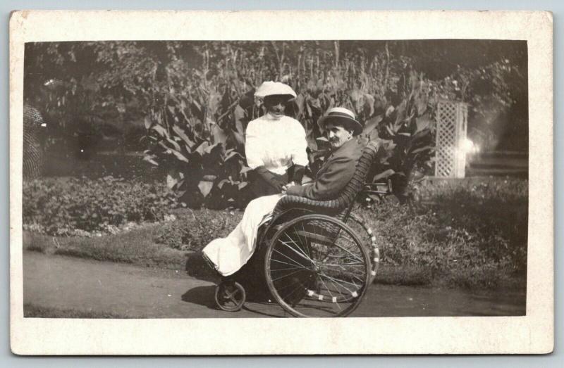 RPPC Wife Nurses Convalescing Husband~Take Garden Stroll~Wicker Wheelchair~c1914 