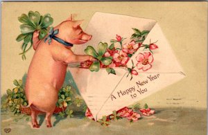 New Year PC Pig Putting Pink Flowers and Four Leaf Clovers Into Envelope Letter