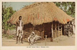 Trinidad B.W.I. An East Indian Family Thatch Roof Real Photo Postcard