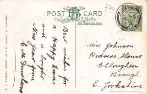 A047 Christmas greetings 1912 mistletoe hut trees snow embossed postcard