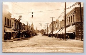 J90/ Hartford Wisconsin RPPC Postcard c1910 Luttropp Company Main St 284