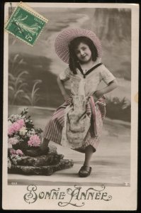 Sazerac Bonne Annee. Hand tinted RPPC. Little girl. Circa 1910