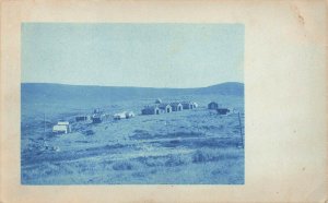 Wiley WY Regular Bunk Houses and Commissary Needs Trees Real Photo Postcard