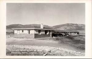 RPPC Frontier Motel, Granby CO Electric Heat Can't Be Beat Vintage Postcard V74