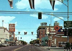 1960s WINNEMUCCA NEVADA MAIN STREET 76 GAS STAR FINEST FOOD CHROME POSTCARD P546