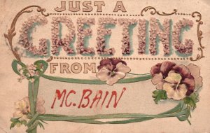 Vintage Postcard 1923 Just A Greeting from Mc. Bain Large Letter Flowers Pansie