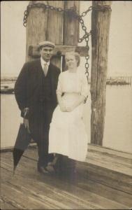 Couple on Pier Posing - Pylons - 1910 Winsted CT Cancel Real Photo Postcard