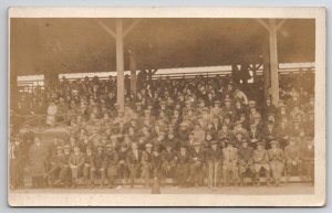 RPPC Large Crowd Mostly Men on Bleachers Real Photo Man Crutches Postcard A47