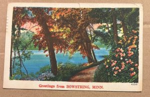 VINTAGE USED 1953 LINEN POSTCARD - GREETINGS FROM BOWSTRING, MINN. - RIP ON TOP