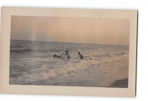 Men Canoeing in Ocean RPPC Real Photo 1907-1918 Unknown Location