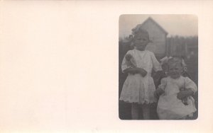Real Photo Postcard~Little Girls in White Lace Hold Dolls~Pigtails~c1912 RPPC