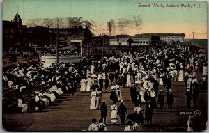 1909 ASBURY PARK N.J. BOARD WALK WELL DRESSED LADIES AND MEN POSTCARD 14-105