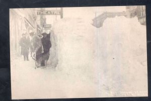 REAL PHOTO ALPENA MICHIGAN DOWNTOWN STREET SCENE WINTER SNOW POSTCRAD COPY
