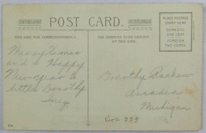 Young Woman in Long Coat Carries Wreath Knocking At Door - Vintage Postcard