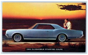 c1965 1965 Oldsmobile Starfire Coupe Automobile View Lansing Michigan Postcard