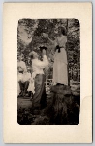 RPPC Woman Tambourine Tree Stump Will He Catch Her If She Jumps  Postcard M27