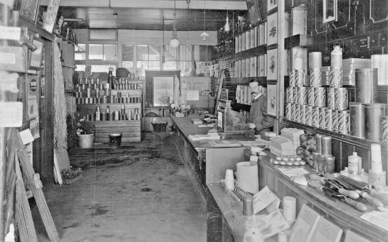 MERCHANT IN HARDWARE GARDEN STORE~CANARY GUANO CANS -UK? PHOTO POSTCARD 