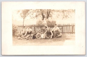 RPPC Loafing Farm Boys Hang Out w/Pet Dog~Painted Picket Fence, Whitewashed Tree