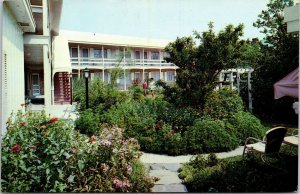 VINTAGE POSTCARD INNER COURT OF THE THE DINNER BELL INN AND MOTEL REHOBOTH BEACH