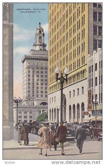 Busy flow of traffic in business district, Owntown, Oakland, California, 30-40s