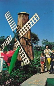 Panama City Beach FL Goofy Golf Family with Wind Mill Postcard