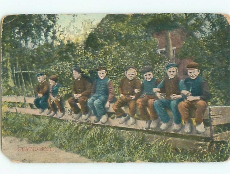 Pre-Linen foreign BOYS SITTING ON FENCE IN STAPHORST NETHERLANDS J4634