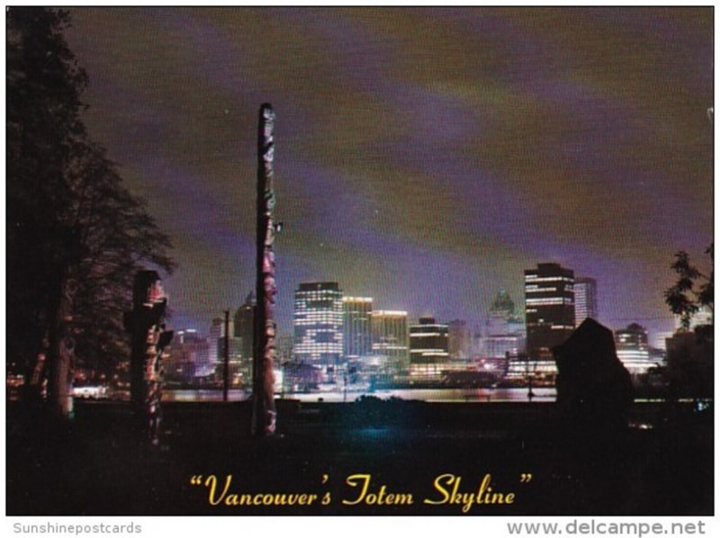 Canada Vancouver Skyline At Night From Totem Pole Section In Stanley Park