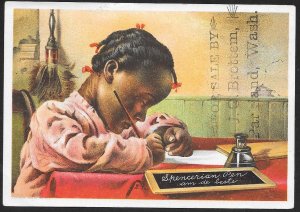 VICTORIAN TRADE CARD Spencerian Pens Black Girl Sitting at Table Writing c1888