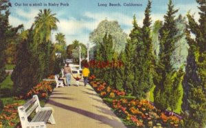 couple with child OUT FOR A STROLL IN BIXBY PARK. LONG BEACH, CA 1958 