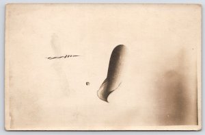 RPPC Picture~German Observation Balloon Blimp~Spying on Dutchmen~Across Line WWI