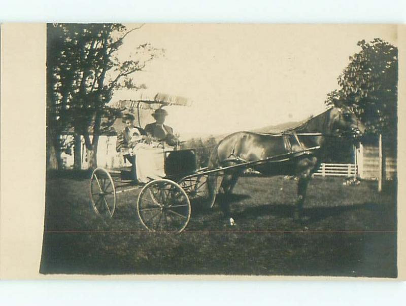 rppc Pre-1920's WOMEN HAVE UMBRELLA COVERING FOR THEIR CARRIAGE AC7991