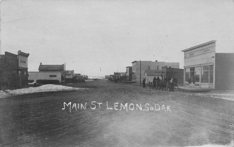 Lemon SD Main Street Storefronts Horses Snow in 1908 RPPC