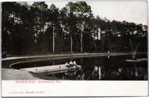 boys sitting on dock at Riverside Park, Jacksonville, Florida postcard