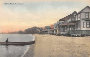 Clinton Beach Connecticut man in boat on beach by houses antique pc ZE686208