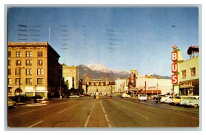 Pikes Peak Avenue Looking West Vintage Standard View Postcard Old Cars Signs