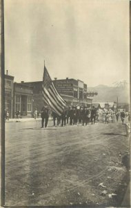 RPPC Postcard Parade Main Street Livingston MT US American Flag in Front G.A.R.?