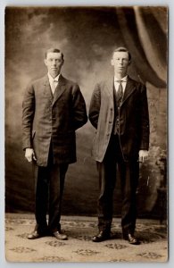 RPPC Two Young Men Pose For Photo In Studio c1915 Postcard B40