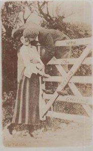 Climbing Over Garden Gate For Kiss Harrassing Lady Antique Real Photo Postcard