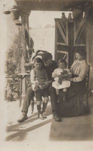 British Family in WW1 Giant Union Jack Flag Teddy Bear RPC Postcard