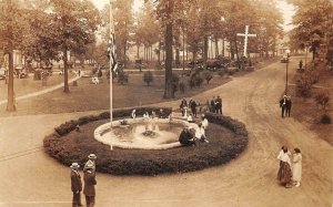 RPPC PARK FOUNTAIN FLAG RELIGION CROSS CARS  REAL PHOTO POSTCARD (1920s)