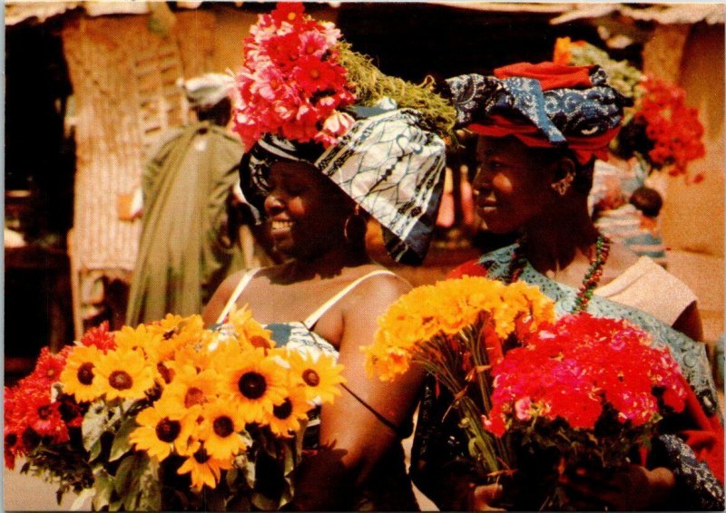 VINTAGE CONTINENTAL SIZE POSTCARD AFRICAN WOMEN TRADITIONAL HEAD DRESS & FLOWERS