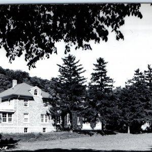 c1950s Elkader, IA RPPC Catholic Buildings Huge Stone Church Spire Bell PC A110