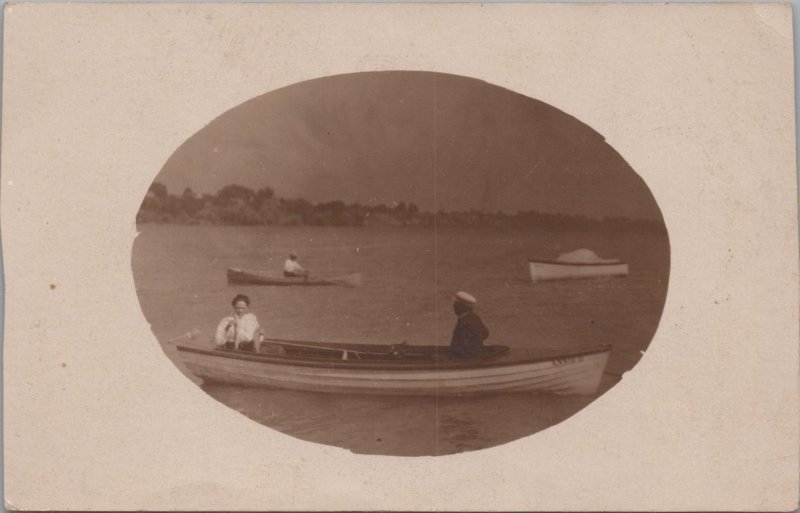 RPPC Postcard Man + Woman Fishing on a Boat Holding Fish They Caught